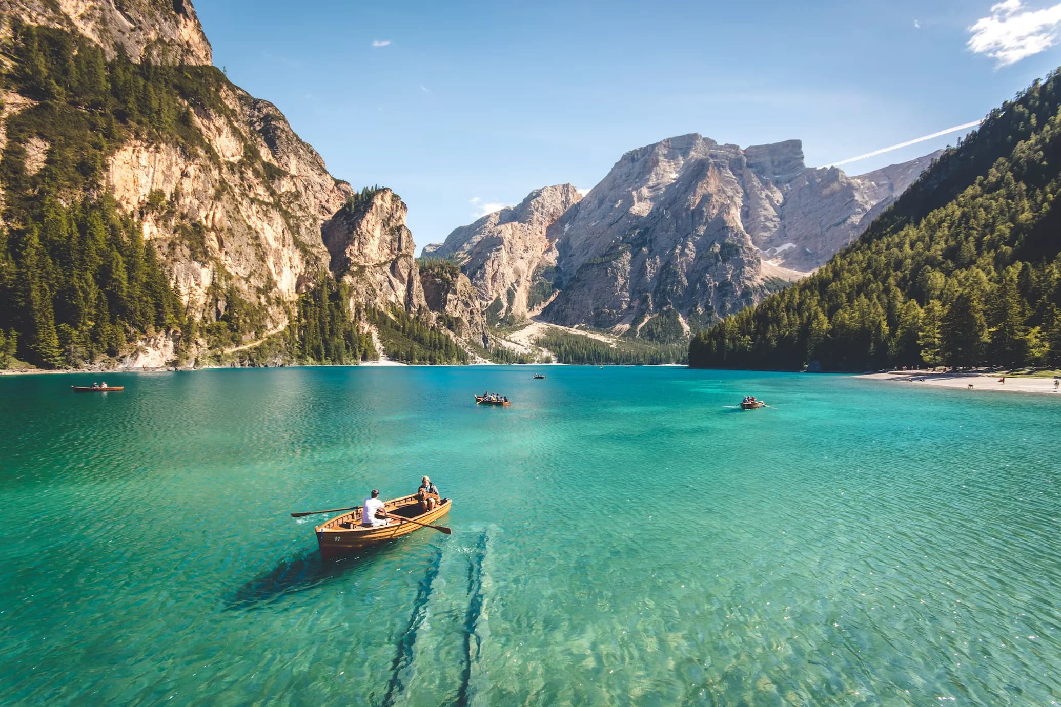 A calm turquoise mountain lake — balance between ambition and wellbeing.